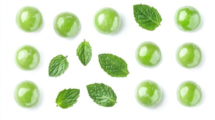 Close up of green tea-flavored candy balls with mint leaves, arranged neatly on a white background. Sweet treat perfect for teas or desserts.
