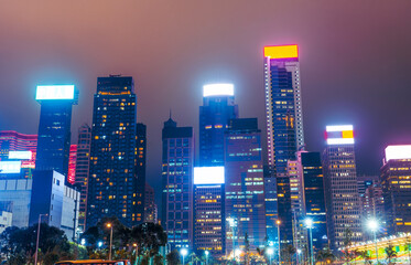 Naklejka premium Hong Kong at night view on skyscrapers silhouette buildings backlit light