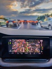 View from inside of a car. Traffic jam on hightway. Most of the roads are closed on navigation map. Social issues and problems.