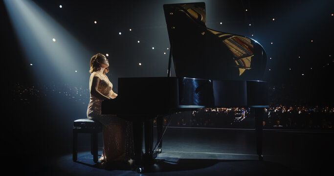 Portrait of a Talented Asian Pianist Captivating Audience with a Masterful Performance on a Grand Piano. Under Soft Stage Lights, Her Fingers Move Across the Keys, Creating Beautiful Classical Music