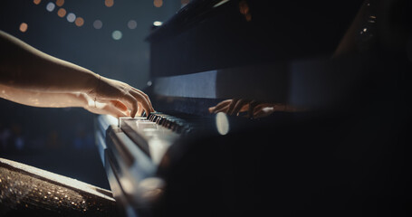 Close Up on Pianist's Hands. Female Performing Classical Instrumental Music on Stage. Musician Using a Grand Piano to Create Beautiful, Melodic Improvisation. Spectators Sitting in the Concert Hall