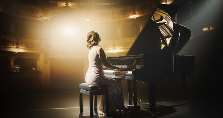 Female Pianist Playing Academic Music, Performing Classical Solo Compositions on Stage. Grand Piano...