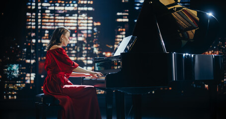Talented Female Pianist in Red Dress Captivates the Audience with Her Masterful Performance on a...
