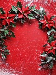 Festive Christmas Wreath with Red Poinsettias and Holly on Snowy Red Background for Decorative Use in Holiday Arts and Crafts
