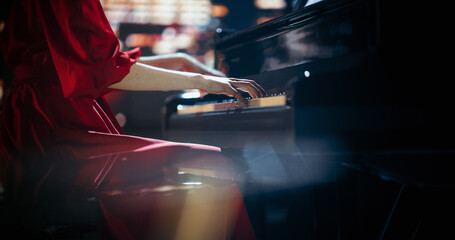 Close Up on Hands of a Talented Anonymous Pianist Making a Masterful Performance on a Grand Piano....