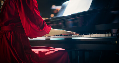 Close Up on Hands of a Talented Anonymous Pianist Making a Masterful Performance on a Grand Piano....