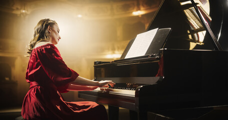 Emotional Female Performing Classical Instrumental Music on Stage. Young Musician Using a Grand...
