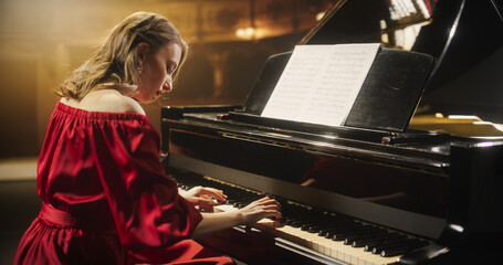 On a Bright Golden Concert Stage, Female Pianist Delivers an Emotional Improvisation on a Grand...