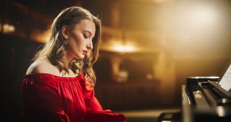 Female Pianist Playing Academic Music, Performing Classical Solo Compositions on Stage. Grand Piano Resounds With Rich, Melodic Tones of a Romantic Ballad, Young Pianist Leaving the Audience in Awe