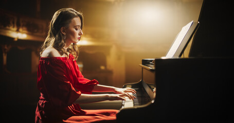 Talented Female Pianist Captivates the Audience with Her Masterful Performance on a Grand Piano. On...
