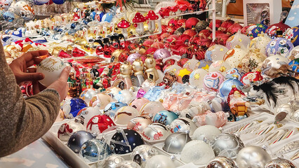 Displays of holiday decorations at a Christmas market during the Christmas season. Alsace, France