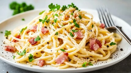 Creamy Spaghetti Carbonara with Bacon and Fresh Herb Garnish on Plate