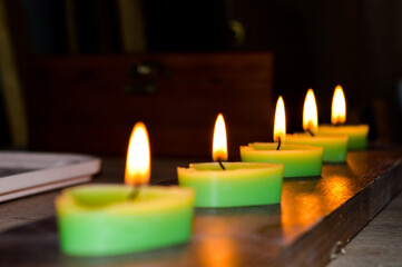 green pink white tealight candles burning romance celebration ritual saraswati indian culture diwali holiday services selling candles Valentine's Day home decor DIY handcrafted aesthetics festive 