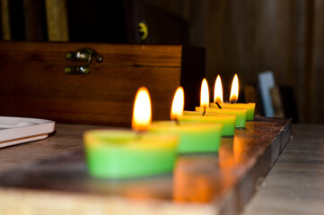 green pink white tealight candles burning romance celebration ritual saraswati indian culture diwali holiday services selling candles Valentine's Day home decor DIY handcrafted aesthetics festive 