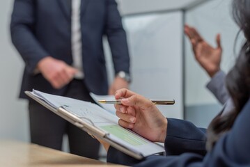 A business person reviewing financial graphs and charts.