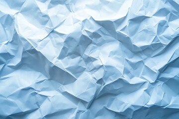 Obraz premium Crumpled white paper forms a textured background, featuring various folds and creases, with a subtle light blue tint