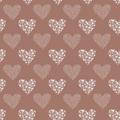 Seamless pattern for Valentines Day with hearts consisting of white heart outlines and white filled hearts on a mocha mousse background. Perfect for textile, fabric, wrapping paper, backdrop, bedding