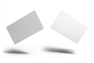 wo surreal white business cards floating in midair and isolated on a white background. 