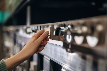 Kitchen hood. Close up view of woman that is in the hardware store