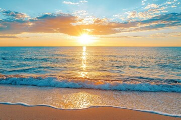 A tropical beach sunset with sunrise-like clouds. Banner for travel and vacation. Scenic sky and rays reflecting in the water. Sunrise over the tropical sea. Tranquil, golden background sky.