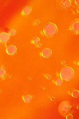  Dynamic abstract background of floating oil bubbles in vivid orange tones. Ideal for creative designs, food concepts, and modern visuals. Oil drop photography 