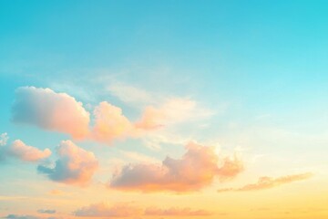 Fototapeta premium A magnificent, opulent soft gradient of orange and gold clouds bathed in sunlight under a blue sky, ideal as a background, taken during evening twilight. This is a large, high-definition landscape