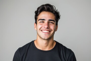 Portrait of young Hispanic man in mock up black t shirt