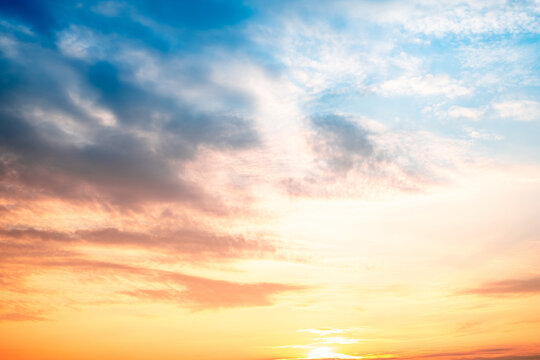 Sky,sunset, beautiful , luxury soft gradient orange gold clouds and sunlight on the blue sky perfect for the background, Sunrise on morning or everning in winter warm time ,Twilight summer,silhouette