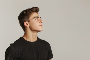 Fototapeta premium Handsome man in black t shirt with confident smile.
