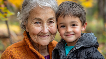 Fototapeta premium Happy grandmother and grandson enjoying nature together