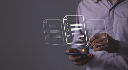 Young man holding smartphone mobile hand using a pen touching to sign a online business contract,...