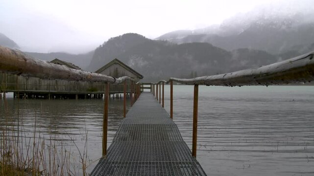 Scenic video footage of Kochelsee (Lake Kochel) in Bavaria, Germany. The peaceful alpine lake is surrounded by mountains and natural landscape, creating a calm and atmospheric scene. Ideal for concept