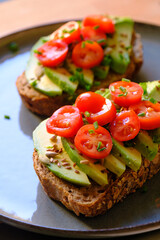 Vegan Avocado Toast with Cherry Tomatoes and Seeds - Healthy Breakfast