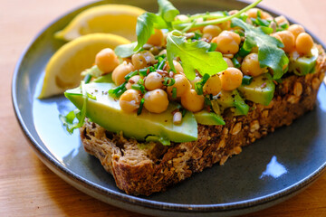 Vegan Avocado Toast with Chickpeas, Arugula, and Seeds - Healthy Breakfast