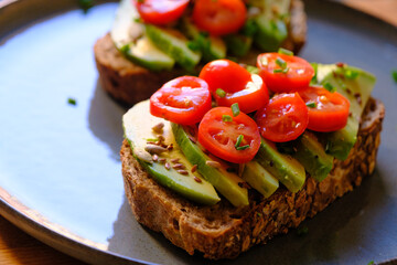Vegan Avocado Toast with Cherry Tomatoes and Seeds - Healthy Breakfast
