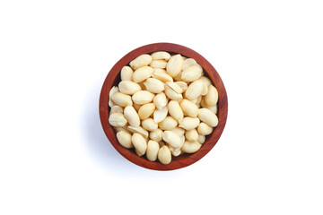 Peeled peanut in wooden bowl isolated on white background. Top view