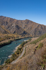 Beautiful autumn landscape, with a river and a road