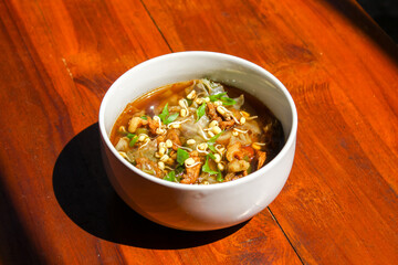 Rawon (Indonesian beef soup). It is originating from East Java, rawon utilizes the black keluak nut as the main seasoning, which gives a dark color and nutty flavor to the soup.