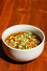 Rawon (Indonesian beef soup). It is originating from East Java, rawon utilizes the black keluak nut as the main seasoning, which gives a dark color and nutty flavor to the soup.