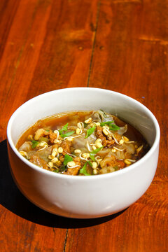 Rawon (Indonesian beef soup). It is originating from East Java, rawon utilizes the black keluak nut as the main seasoning, which gives a dark color and nutty flavor to the soup.