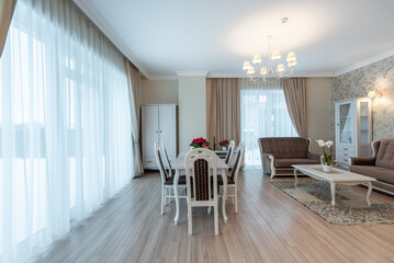 Elegant Home Living and Dining Room Interior with Modern Furniture and Large Windows