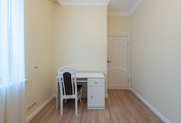 Minimalist Home Room with White Desk and Chair in a Bright Setting. Interior