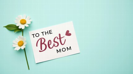Naklejka premium A card for Mother's Day with text To the Best Mom and a small flower beside it on a pastel teal background