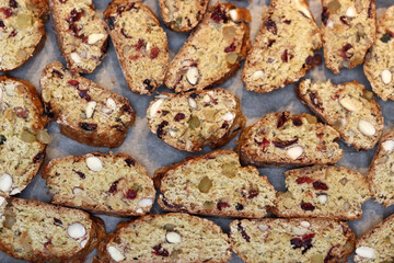 Ingredients for making cranberry pie - eggs, flour, sugar, nuts, raisins on a gray background