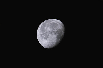 Rare celestial event lunar occultation of Saturn, close-up shot of bright moon © Yi