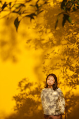 One Asian woman enjoying autumn scenery of Ayuwang Temple (Temple of King Ashoka, Ningbo Ashoka Temple), a Buddhist temple located in Yinzhou District of Ningbo, Zhejiang, China