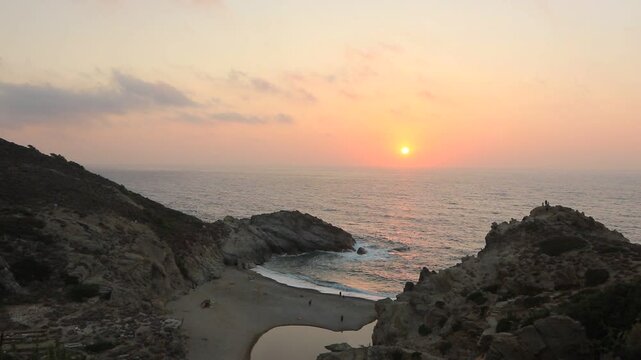 Ikaria travel video showing Nas beach embedded in gorgeous canyon landscape with Halares river at sunset.
