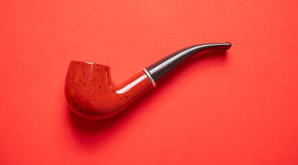 Elegant wooden smoking pipe. Bad addiction