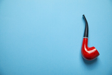 Elegant wooden smoking pipe. Bad addiction