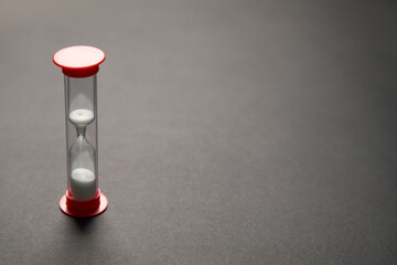 Elegant hourglass filled with white sand. Time